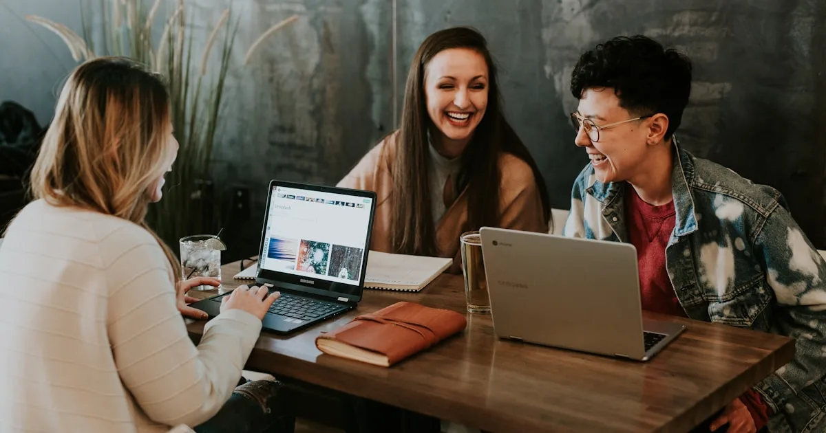 Digital nomads working with laptops in a modern coworking space