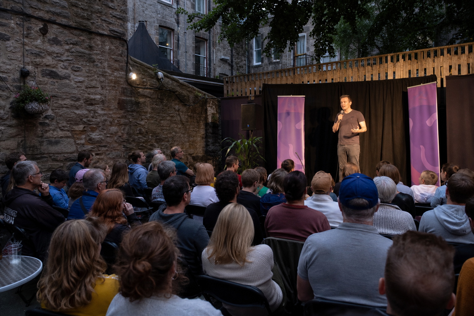 Outdoor comedy performance at Edinburgh Fringe in a courtyard venue