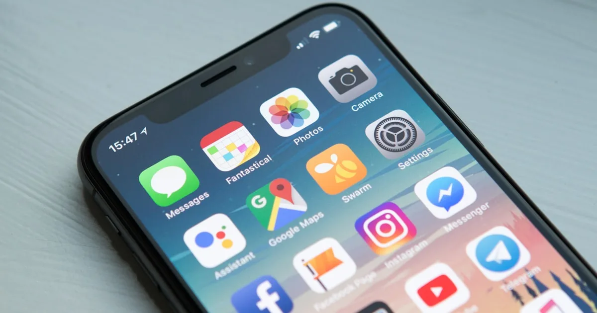 Traveler using smartphone for eSIM setup and configuration