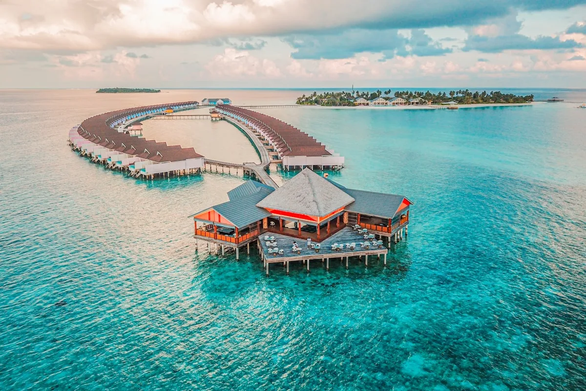 White sand beach and palm trees on a Maldives island